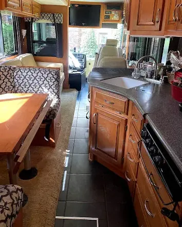 Wood cabinetry and seating inside an RV