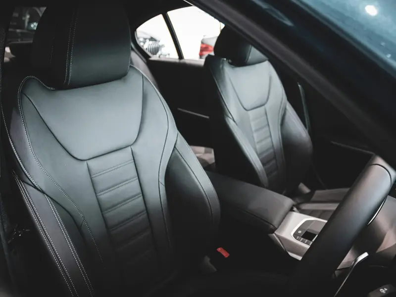 Clean black leather front seats in a car interior